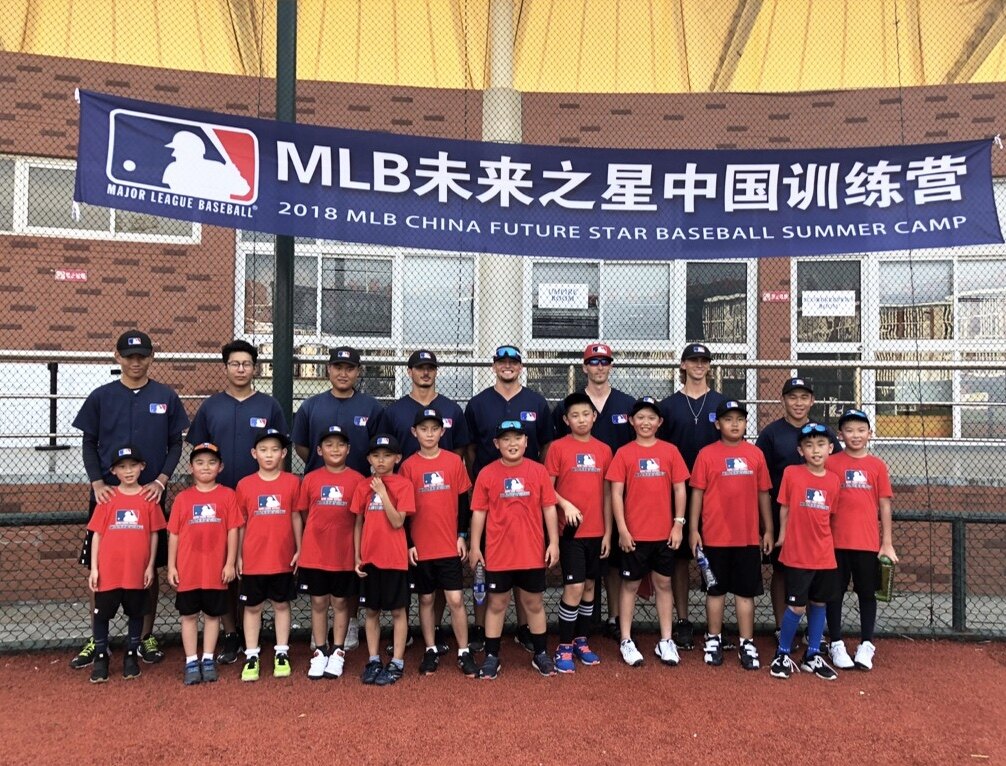 Tate Gillespie with coaches and young athletes at an MLB China program