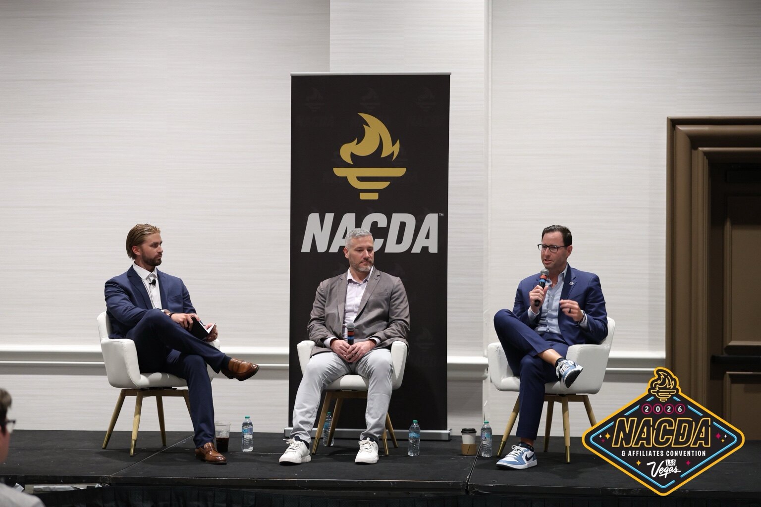 Tate Gillespie moderating a national sports-industry panel